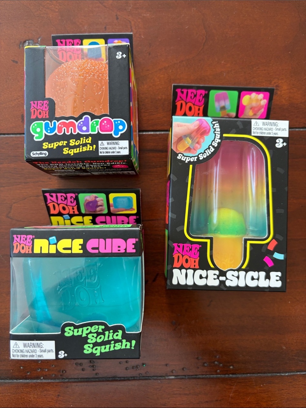 NeeDoh Kids Super Solid Squish Variety Pack - Orange, Teal & Rainbow